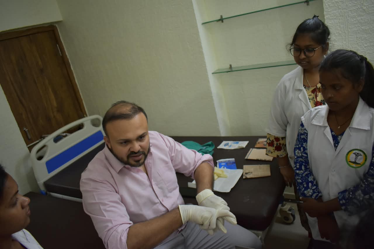 Dr. Ekansh Debuka demonstrating clinical technique to nursing students