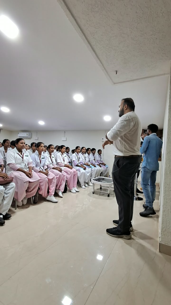 Dr. Ekansh Debuka speaking with nursing students during a training session