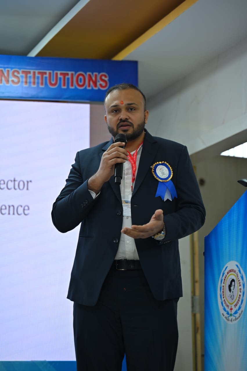 Dr. Ekansh Debuka speaking at a nursing college conference